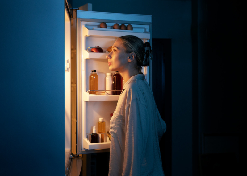 side-view-woman-looking-fridge.jpg
